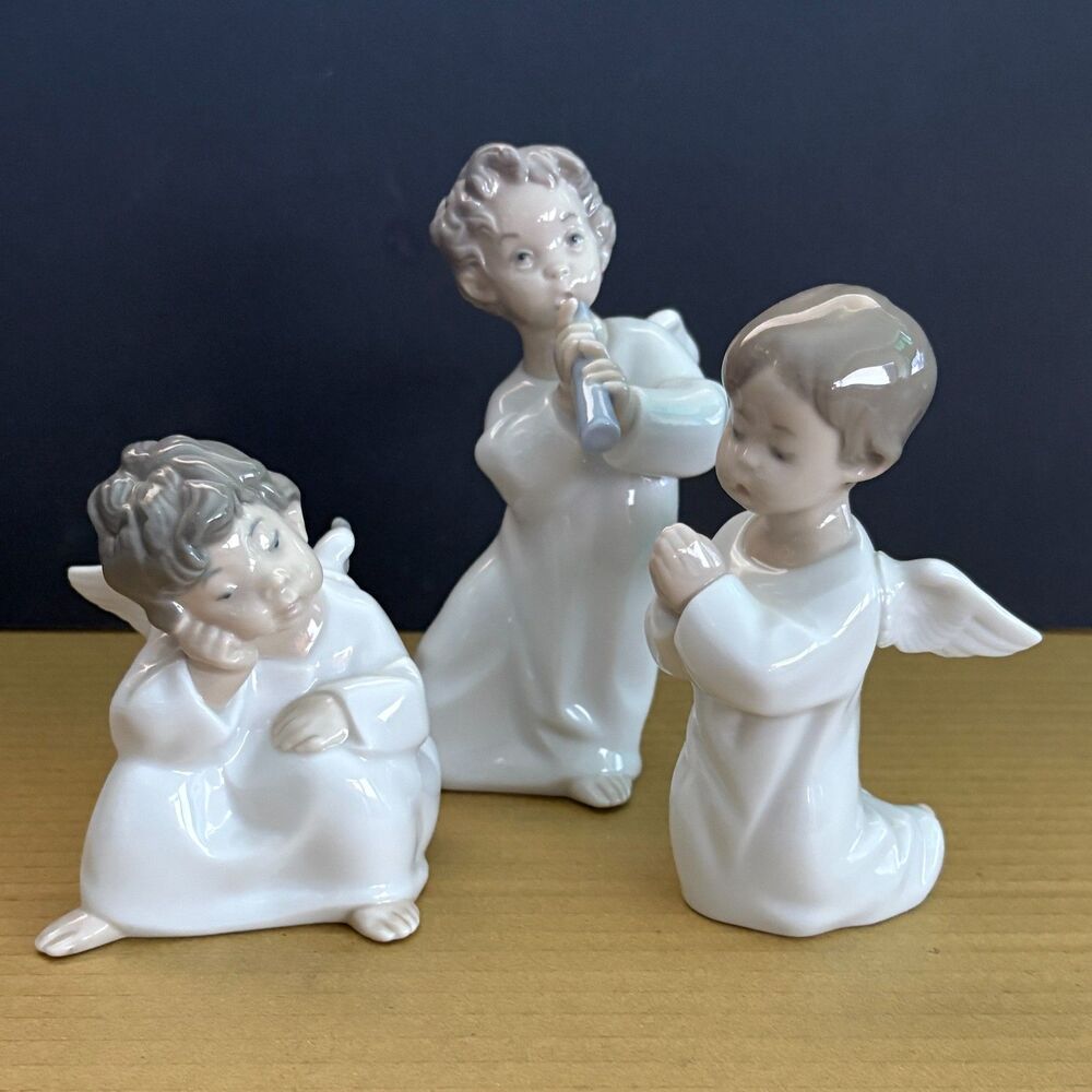 Lladro Porcelain Angel Figurines (3) "Little Angels in White" Collection.